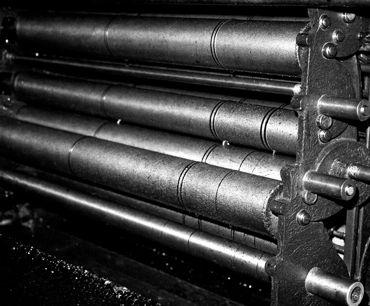 Close-up of printing ink being mixed with a palette knife on a steel slab