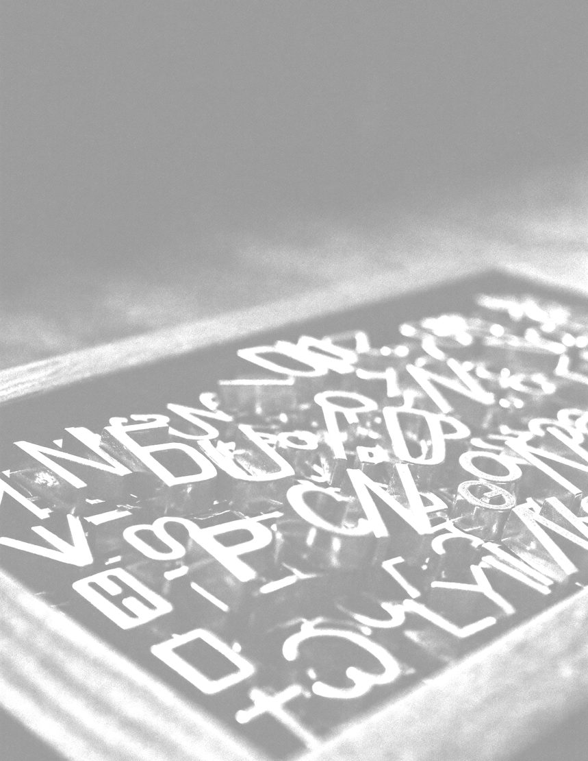 Close-up of a foil-blocked blank panel catching hard light, no design on it