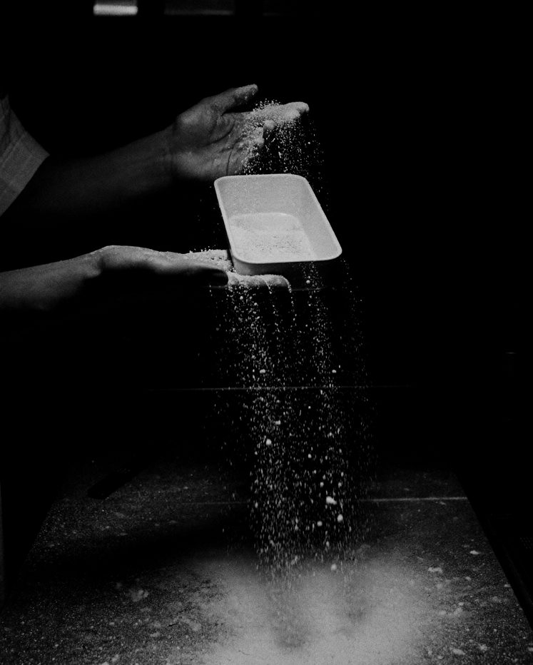 Close-up of printing ink being mixed with a palette knife on a steel slab