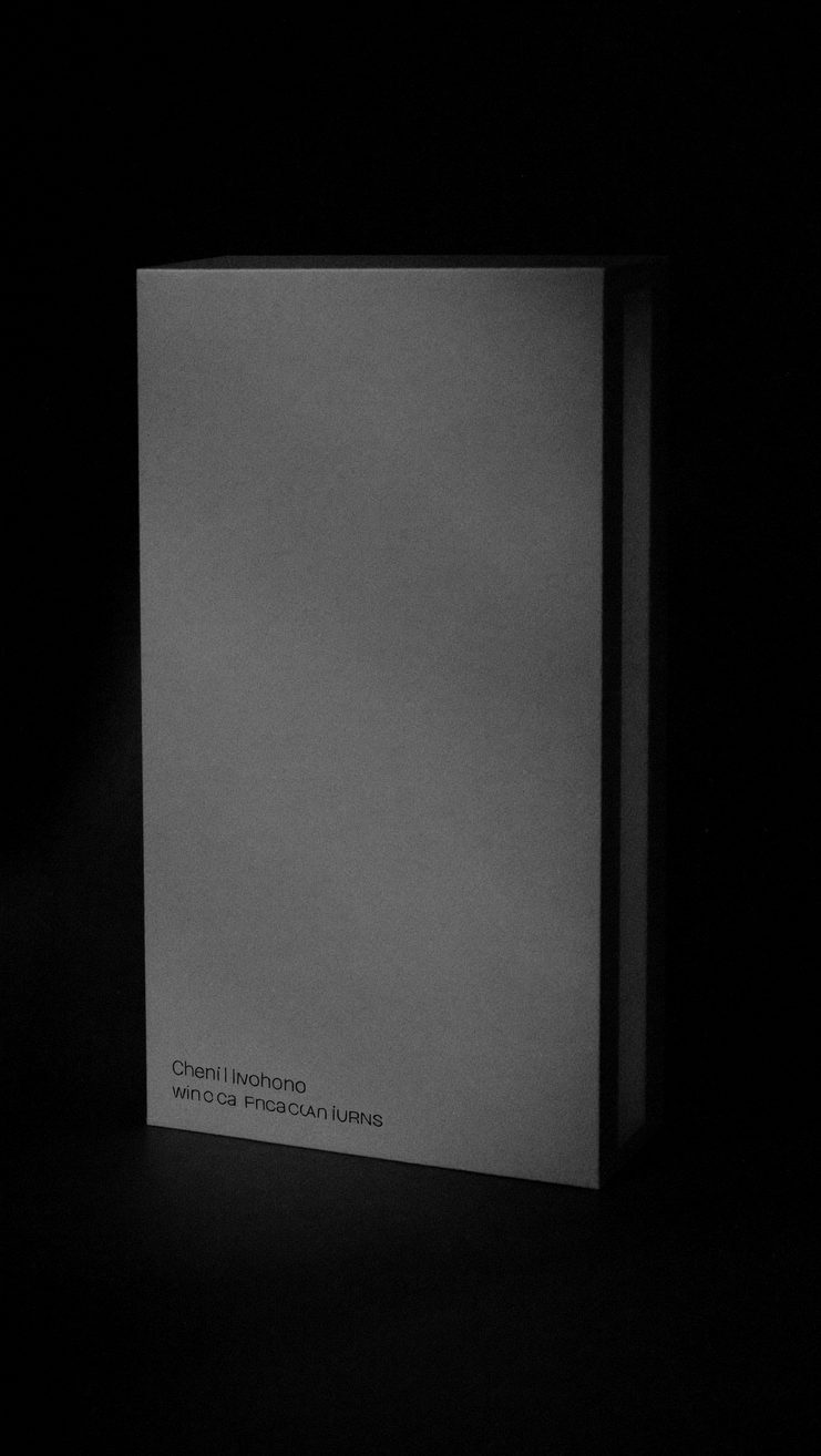 An empty reception desk in shadow with one shaft of light across it