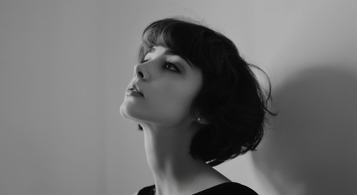Front-facing greyscale portrait