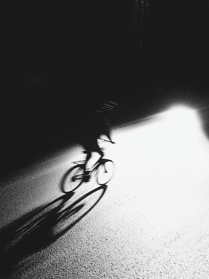 Figure with dramatic backlighting and motion blur